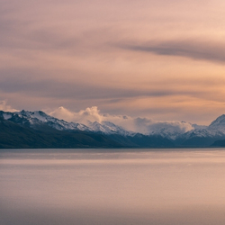 One of three pictures of a peaceful sunset over Lake Pukaki and a distant mountain rage.
