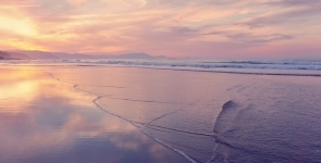 Sunsest reflections over a beach